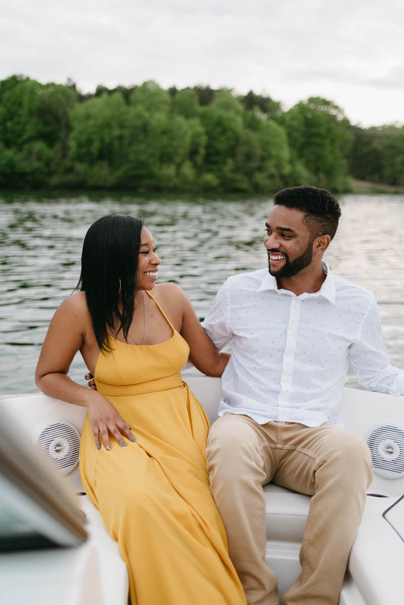 couple sitting on a boat together smiling