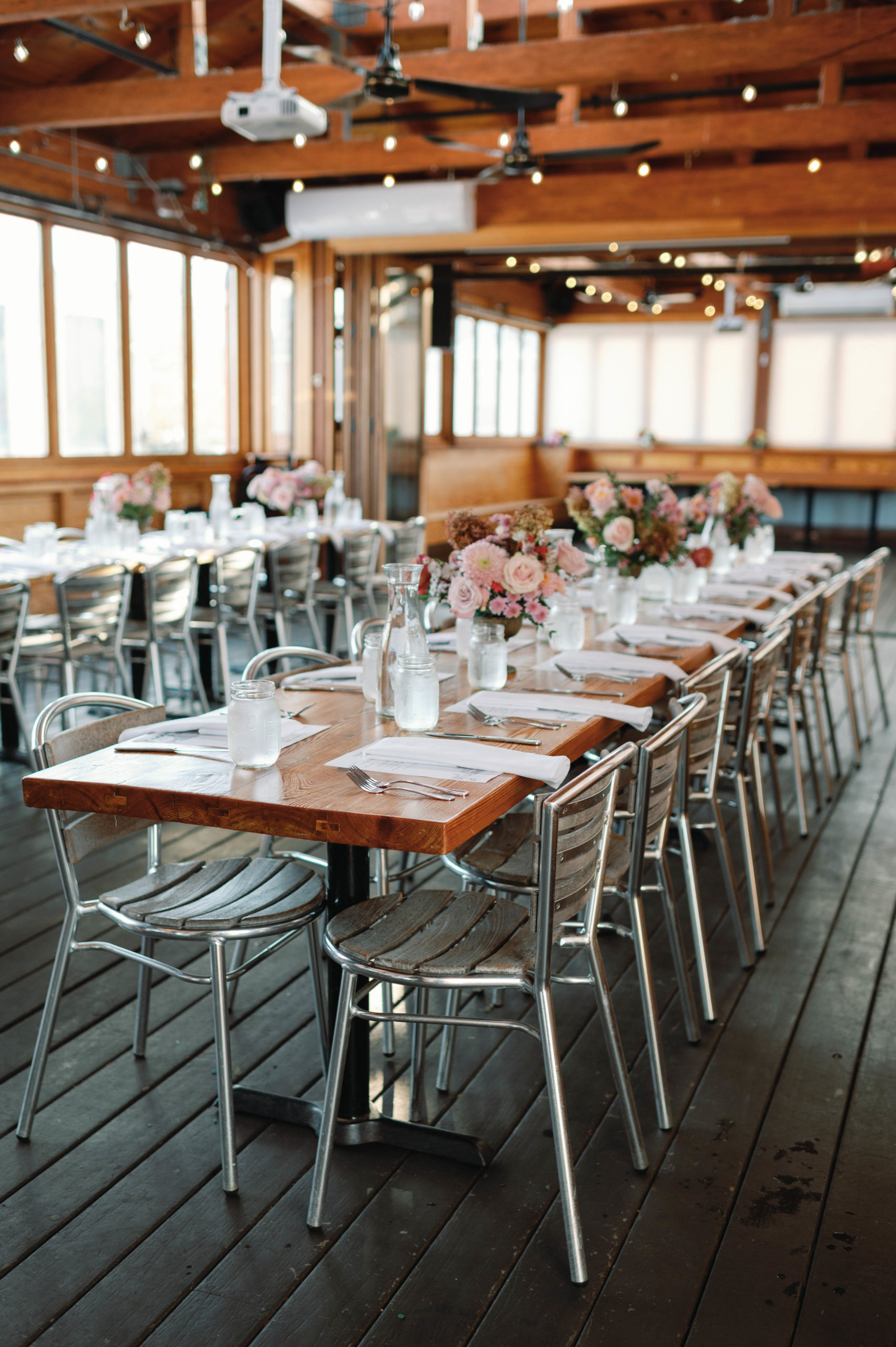 intimate reception venue with flowers and lights