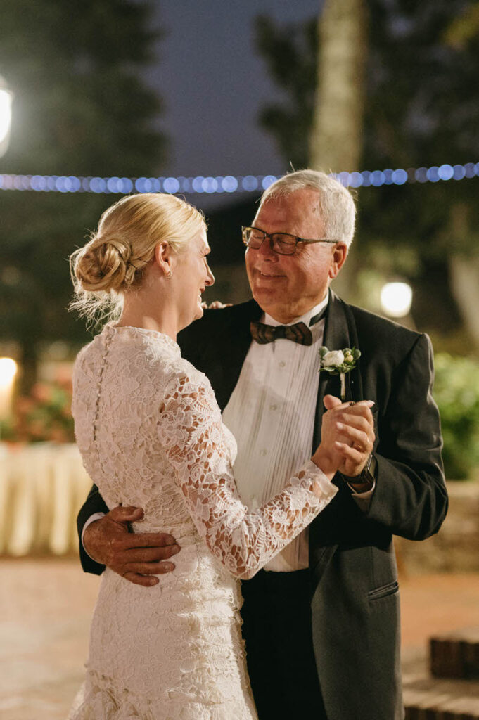 A bride dancing with their father on their wedding day. 